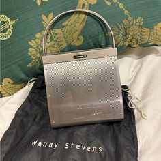 Wendy Stevens One Of A Kind Metal Handbag With Dust Bag And Care Cards Excellent Condition/Only Used One Or Two Times Attached A Reference Photo From Website For Pricing; Not The Same Bag 6”Length 6”Height, 9” Height Including Handles Designer Rectangular Evening Bag With Handles, Designer Rectangular Evening Bag With Silver-tone Hardware, Silver Rectangular Box Bag With Top Carry Handle, Silver Rectangular Evening Bag For Travel, Evening Tote Bag With Silver-tone Hardware, Silver-tone Satchel Box Bag For Shopping, Silver Shopping Bag With Top Carry Handle, Chic Evening Bag With Silver-tone Hardware For Shopping, Rectangular Box Bag With Silver-tone Hardware For Shopping