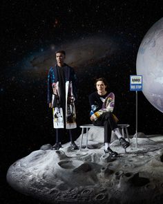 two people are sitting on the moon in front of an image of earth and stars