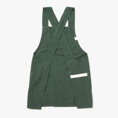 an apron that is green with white straps