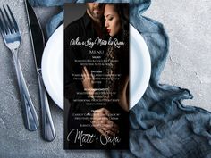 a menu card with an image of a man and woman on it next to silverware