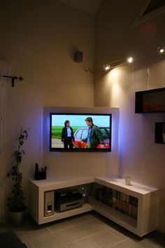 a flat screen tv mounted to the side of a wall