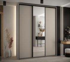 an open sliding door in a room with white walls and black trim on the doors