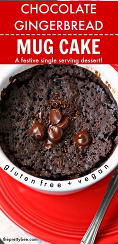 chocolate gingerbread mug cake in a red bowl on a white plate with silverware