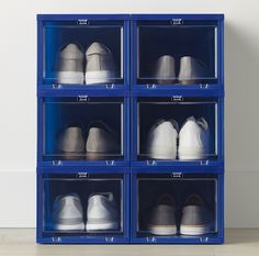 four blue shelves filled with different types of shoes