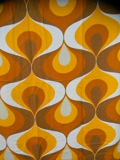 an orange, brown and white pattern on fabric