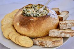 a white plate topped with bread and crackers