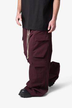 the Rave Double Cargo Pants are designed with a new oversized rave fit, constructed from a polyester fabric with a rinse wash, contrast drawcord, and finished with cargo pockets throughout. details ultra baggy fit throughout 100% polyester extended inseam model is 6’1, 140 lbs and wears a size 30 Nylon Windbreaker Pants, Relaxed Fit Parachute Pants With Multiple Pockets, Streetwear Full Length Parachute Pants With Patch Pockets, Streetwear Full-length Sweatpants With Cargo Pockets, Streetwear Full-length Parachute Pants With Patch Pockets, Full Length Sweatpants With Cargo Pockets For Streetwear, Full Length Parachute Pants With Patch Pockets For Streetwear, Streetwear Parachute Trousers With Patch Pockets, Sporty Baggy Pants With Patch Pockets