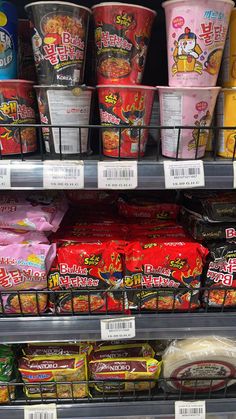 an assortment of frozen food items on display in a store