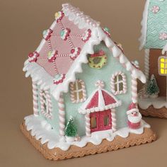 a gingerbread house is decorated with candy canes