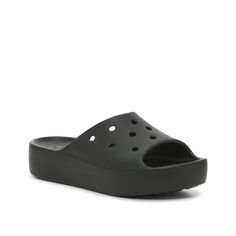 Crocs-Classic Platform Slide Sandal - Women's From poolside hangouts, to seashore adventures, you'll find yourself reaching for the Crocs Classic platform slides time after time. This casual closet must-have features an easily accessible slip-on design, a durable platform silhouette, and a supportive footbed. The versatile style and quality materials of this pair makes them a comfortable and timeless addition to any warm weather closet. Black Open Toe Sandals For Poolside, Black Open Toe Sandals For Pool, Black Slides For Poolside Summer, Black Pool Sandals For Summer, Black Summer Sandals For Poolside, Black Synthetic Sandals For Pool, Casual Black Sandals For Poolside, Casual Black Pool Sandals, Lightweight Black Slides For Beach