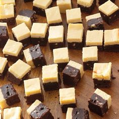 several pieces of cake sitting on top of a wooden cutting board next to each other