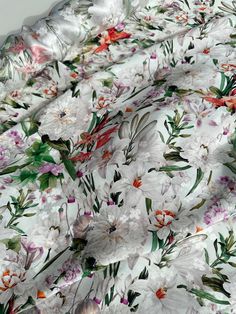 an image of white flowers and green leaves on a floral print sheet set with matching pillow cases