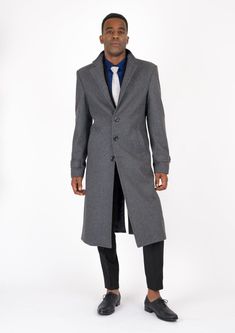 Boost your style in the timeless Grey Wool Classic Long Overcoat. Crafted from luxurious melton wool, this coat is custom-made for a sophisticated and classy vibe. Make an elegant statement with this sleek overcoat, crafted to extend to just below the knee. Long Wool Coat For Formal Occasions, Formal Long Wool Coat With Concealed Placket, Luxury Long Wool Coat For Formal Occasions, Formal Solid Single-breasted Wool Coat, Elegant Long Wool Coat, Formal Fitted Wool Coat In Solid Color, Fitted Solid Wool Coat For Formal Occasions, Solid Formal Fitted Wool Coat, Solid Color Fitted Wool Coat For Formal Occasions