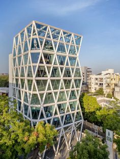 an office building that is surrounded by trees