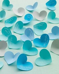 blue and white paper hearts with words on them