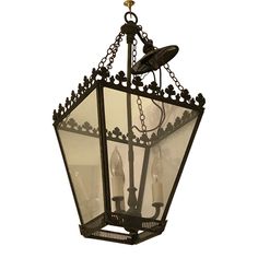 an old fashioned hanging light fixture with two lights