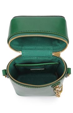 Crafted from vegetable-dyed leather, this handware-enhanced bag features a crossbody strap for hands-free wear. Top carry handle; removable, adjustable crossbody strap Textile with leather trim Imported Crossbody Mobile Phone Box Bag, Green Leather Bucket Box Bag, Green Leather Bucket Bag With Detachable Strap, Green Crossbody Shoulder Bag With Gold-tone Hardware, Chic Green Phone Bag With Detachable Strap, Green Bucket Bag With Gold-tone Hardware For Everyday, Green Leather Shoulder Phone Bag, Green Crossbody Box Bag With Detachable Strap, Green Leather Phone Shoulder Bag