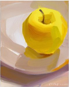 a yellow apple sitting on top of a white plate