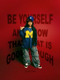 a young man standing in front of a red wall with the words, be yourself and know that is good enough