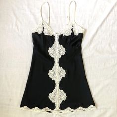 1 Owner. Wore This Once Or Twice. Only Selling Because The Bust Is Too Big! Beautiful To Wear As A Sip Dress!! Bought At Barneys Ny. Super Luxe. Great With Tights Or Over A Slim Pant. French Seams And Beautifully Constructed. All Measurements Are Approximate. Measured Flat: Bust 16", Length From Top Of Side Seam 20.5" Fitted Black Slip Dress With Lace Trim, Black Summer Mini Dress With Playful Style, Black Coquette Mini Dress For Summer, Black Sleeveless Flirty Mini Dress, Black Sleeveless Coquette Mini Dress, Vintage Black Spaghetti Strap Dress, Silk Tee, Black Slip Dress, Black Lace Bra