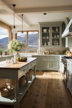 a kitchen filled with lots of counter top space next to a wooden floor covered in pots and pans