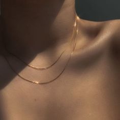 This silky Ultra Thin Snake Chain Necklace is giving us sexy vibes and we're totally unapologetic about it! This necklace can be layered up for a maximalist look or worn alone which looks impeccable as it drapes over your collarbone. Add the Retro Rope Chain or the delicate clavicle choker - this necklace is a staple every girl needs in her jewelry box. DETAILS & SIZE Composition: 18k gold plated over 316L Stainless Steel Measurements: Thickness: 0.87mm; length: 16" or 18" + 2" extension Lobster Hot Necklaces, Diy Jewelry Gifts, Neck Chain, Gold Necklaces, Chain Choker Necklace, Jewelry Choker, Chain Gold, Choker Necklaces, Chain Choker