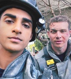 two men wearing helmets are standing next to each other with the caption saying, savin lives one smolder at time