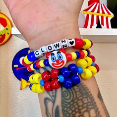 Clown kandi clowncore beaded bracelet set primary color jewelry accessories  Handmade clown beaded bracelet set of 3 with clown emoji charm and alpha beads that say clown  Bright primary colors  Tags; clown clowncore kidcore accessories jewelry bracelets kandi kid rave clown costume pony beads Playful Plastic Jewelry With Letter Beads, Playful Plastic Bracelets With Letter Beads, Customizable Fun Multicolor Beaded Bracelets, Fun Customizable Multicolor Beaded Bracelets, Fun Customizable Multicolor Stretch Bracelet, Customizable Multicolor Stretch Bracelet, Fun Plastic Beaded Bracelets With Letter Beads, Novelty Plastic Bracelets With Round Beads, Novelty Stretch Bracelet With Colorful Beads