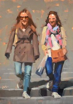 two women walking down the street carrying shopping bags