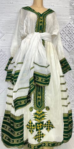 Fitted Traditional Wear With Weaving Work, Traditional Sets With Weaving Work For Ceremonies, Traditional Festive Dress With Weaving Work, Fitted Traditional Wear With Woven Motifs, Fitted Habesha Kemis For Eid, Traditional Green Dresses For Ceremonies