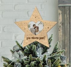 a wooden star ornament with an image of a couple on it