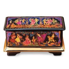 an elaborately decorated box with figures on it