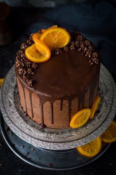 a chocolate cake with orange slices on top