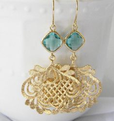 Gorgeous ethnic filigree pendants and sea green glass diamonds hang from 14 karat gold plated earwires. Earrings hang approximately 2 1/2 inches from the ear and come with plastic ear nut protectors. All items are individually gift boxed. Please visit my shop here: https://www.etsy.com/shop/Greenperidot Bridesmaid Earrings Gift, Large Gold Earrings, Green Dangle Earrings, Bridesmaid Gifts Earrings, Flower Girl Jewelry, Gold Filigree Earrings, Bride Earrings, Earrings Bridesmaid, Filigree Pendant