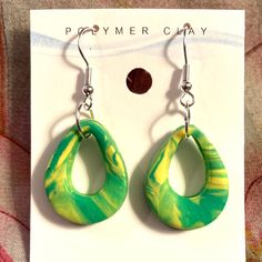 Marbled green and yellow swivel polymer earrings on silver hooks Polymer Earrings, Yellow Earrings, Green And Yellow, Boutique Jewelry, Green Yellow, Marble, Yellow, Green, Silver