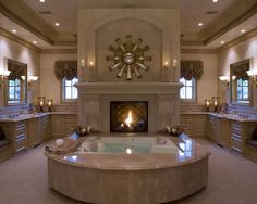 a large bathroom with a fireplace and jacuzzi tub