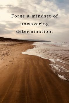 a beach with footprints in the sand and a quote on it that says, force a mindset of unwavering determination