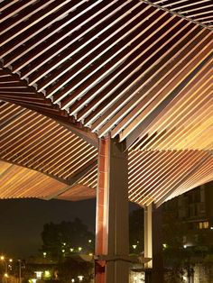 an outdoor covered area at night with lights on