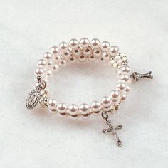 White Flower First Communion   Hand-crafted rosary bracelets   https://ourladysrosegarden.com/product/white-flower-first-communion-rosary-bracelet #RosaryBracelets Cheap White Jewelry For First Communion, Cheap Silver Beads Rosary Bracelet As Gift, Elegant Pearl Rosary Bracelet For Baptism, Pearl Charm Jewelry For First Communion, White Pearl Charm Bracelet For First Communion, White Pearl Rosary Bracelet With Pearl Charm, Pearl Rosary Bracelet For Weddings, First Communion Pearl Drop Jewelry, Spiritual Pearl Rosary Bracelet For Wedding