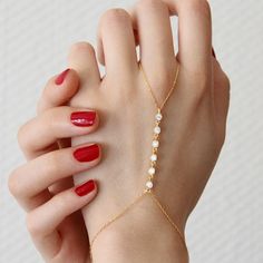 Embrace your inner diva with our Dainty Crystal Handchain. Made from 925 silver, this playful accessory adds a touch of glam to any outfit. The delicate crystals catch the light for a stunning effect. Feel empowered and let your hands do the talking. (Warning: may cause hand modeling aspirations) Metal: 925 sterling silver Finish: 18k gold Gemstone: white zirconia Bracelet length: adjustable with 4 cm extender (1.5") Chain: cable link Clasp: spring ring Hypoallergenic & nickel-free Don’t forget, proper care of your gold-plated jewelry will preserve its appearance for a long time. Keep it shining bright by using the soft side of the provided JFW polishing cloth Adjustable Gold Sterling Silver Crystal Bracelet, Adjustable Gold Sterling Silver Diamond Bracelet, Gold Sterling Silver Adjustable Crystal Bracelet, Dainty Hand Set Adjustable Chain Bracelet, Gold Sterling Silver Diamond Bracelet With Adjustable Chain, Adjustable Hand Set Chain Bracelet For Parties, Adjustable Yellow Gold Jewelry With Sparkling Stones, Tarnish Resistant Gold Plated Diamond Bracelet For Wedding, Dainty Gold Bracelets With Sparkling Stones