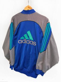 Vintage Adidas Cut and Saw Windbreaker Tracksuit Top jacket Blue/Green/Gray Size M colors: Blue, Gray,Green Condition: Good Please keep in mind that colors from the pictures may vary because of your screen. I SEND WITH TRACKING NUMBER! If any item is lost or damaged in transit I will make a claim with the Post Office but refunds will not be given until the claim has been processed. If you fail to collect the item from collection post office once it arrives, I do not take any responsibility for a Blue Long-sleeved Nylon Track Jacket, Blue Long Sleeve Nylon Track Jacket, Blue Nylon Long Sleeve Track Jacket, Fitted Blue Track Jacket, Blue Color Block Athleisure Track Jacket, Blue Athleisure Track Jacket With Color Block, Blue Athleisure Outerwear With Color Block, Blue Color Block Athleisure Outerwear, Windbreaker Tracksuit