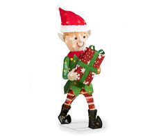 a christmas ornament with a santa clause holding a green gift box and wearing a red hat