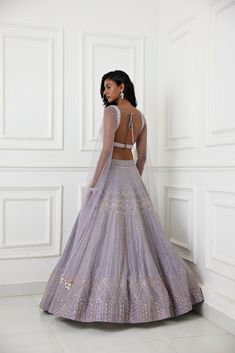 Lilac organza lehenga with glass beads, zardozi and pearl embellishments paired with raw silk embroidered blouse with long tulle cape sleeve.From Chamee and Palak's The Romantics collection.DELIVERY TIMEPlease allow 8-12 weeks for your outfit to arrive.FABRIC DETAILSOrganza, Silk, NetProfessional cleaning only. Organza Choli With Zari Work And Cape Sleeves, Organza Choli With Cape Sleeves And Zari Work, Designer Dresses With Intricate Embroidery And Cape Sleeves, Organza Anarkali Choli With Cape Sleeves, Fitted Lehenga With Resham Embroidery And Cape Sleeves, Anarkali Organza Dress With Cape Sleeves, Festive Organza Lehenga With Cape Sleeves, Anarkali Lehenga With Zari Work And Cape Sleeves, Anarkali Gown With Cape Sleeves And Resham Embroidery