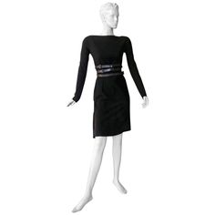 Christian Dior by John Galliano tailored black wool dress inspired by 1950's Christian Dior Haute Couture fashion. Beautifully designed featuring fitted sheath style dress with draped bustle reflecting the draping and style of the New Look asymmetries. An updated 21st century style homage to the House of Dior. Fully lined. Back zipper closure. Size: 36/4: bust: to 36"; waist: 26": hips: 36"; length: 38.5" Condition: very good Elegant Fitted Wool Dress, Black Wool Dress For Formal Occasions, Formal Fitted Wool Dresses, Fitted Wool Formal Dress, Fitted Wool Dresses For Formal Occasions, Fitted Knee-length Wool Dress, Classic Wool Evening Dress, Black Wool Dress For Evening, Black Wool Evening Dress