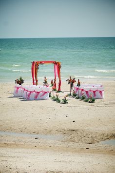 an outdoor wedding setup on the beach