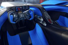 the interior of a sports car is blue and black