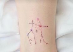 a woman's foot with a small star tattoo on the side of her leg