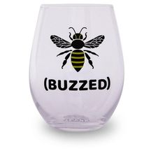 a wine glass with a bee on the front and buzzzed written in black ink