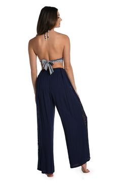 These palazzo pants get their boho-inspired style from crocheted side panels. Perfect for pulling on post dip, you can wear them as a swimsuit cover-up but they also look fabulous with a tank or cami for an effortlessly chic look. A gently elasticized waist offers a comfortable fit. [split] Details Palazzo-style beach pants Elasticized waistband Wide legs for a flowy fit Lightweight rayon fabric Fabric 100% Rayon Pallazo Pant, Palazzo Style, Palazzo Pant, Beach Pants, Rayon Fabric, Wide Legs, Swimsuit Cover, Palazzo Pants, Side Panels