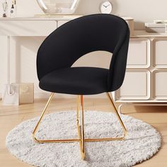 a black chair sitting on top of a rug in front of a white table and dresser